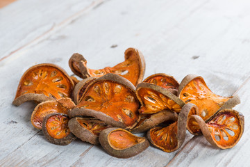 Dry Bael fruit - Slices of dry Bael fruit on the wooden table