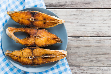 Deep fried fish on wooden table