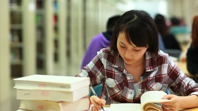 young college student study in library