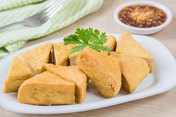 Fried tofu on plate and dip sauce