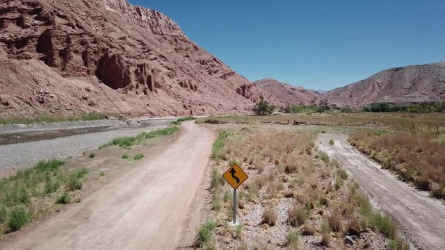 Aerial shot of dirt road in the desert mountain in Atacama desert. 4k