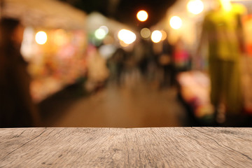 Blank wooden table of brown on front blurred background, mock up for presentation