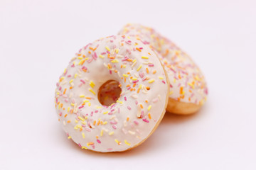 Donuts with Colorful Sprinkles on a  white background
