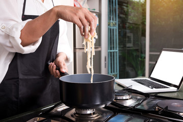 Chef Cutting cook Homemade makes dough fresh Pasta.