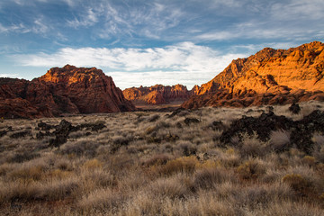 Gorgeous early winter glowing view of The sandstone and volcanic rock of Snow Canyon State Park in...