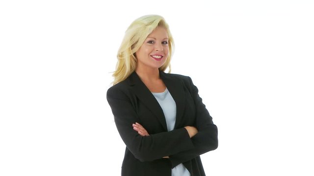 Businesswoman crossing arms and smiling at camera