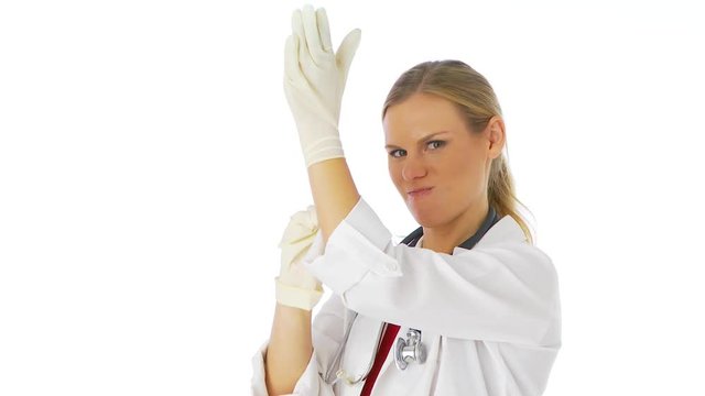 Female doctor putting on gloves