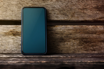 Mobile Phone Mockup Image, Blank Display Screen as Clipping Path, Smart Phone on Old Wooden Desk, Front View