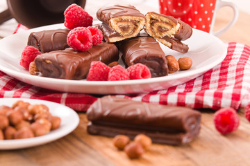 Chocolate rolls with hazelnuts and raspberries. 
