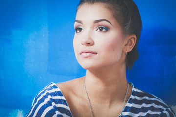 Portrait of female painter lying on floor near wall after painting. Portrait of female painter