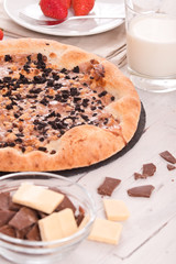 Sweet chocolate pizza with cookies.