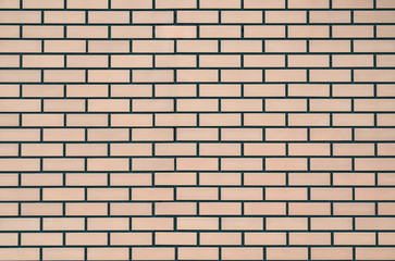 Texture of a colored brick with cement wall, close-up, abstract background for print design