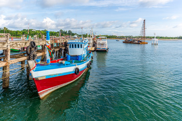 Naklejka na ściany i meble Fishing boats moored at the pier