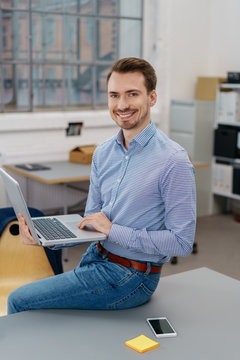 Confident relaxed young businessman