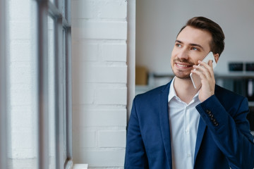 Young businessman talking on a mobile phone