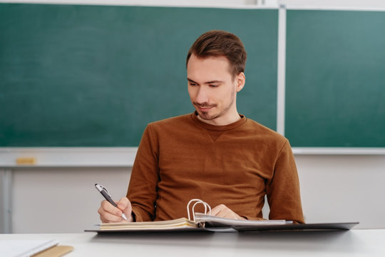 Teacher or mature student working on a file