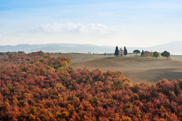 Scenic view of tuscan landscape, rolling hills and Vitaleta chapel in an autumn day, Tuscany, Italy