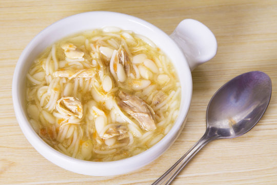garlic soup with noodles and chicken