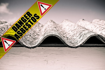 Dangerous asbestos roof with the message 