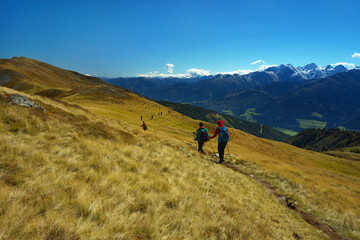 Fototapeta na wymiar Tourist on the mountain way with Hohe Tauern on backround, Austria
