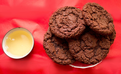 still life, a cup of tea and biscuits, on a red beautiful background with a divorce
