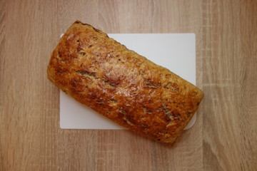Freshly baked homemade bread on rustic table, top view