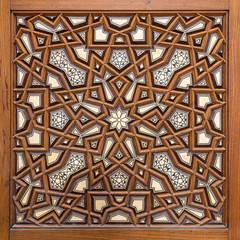 Closeup of arabesque ornaments of an old aged decorated wooden door, Old Cairo, Egypt