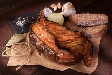 Dried fish steak on wooden background.