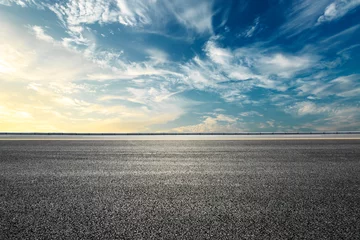 Selbstklebende Fototapeten Empty highway asphalt road and beautiful sky sunset landscape © ABCDstock