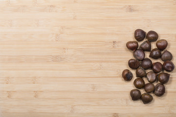 Chestnuts on wood