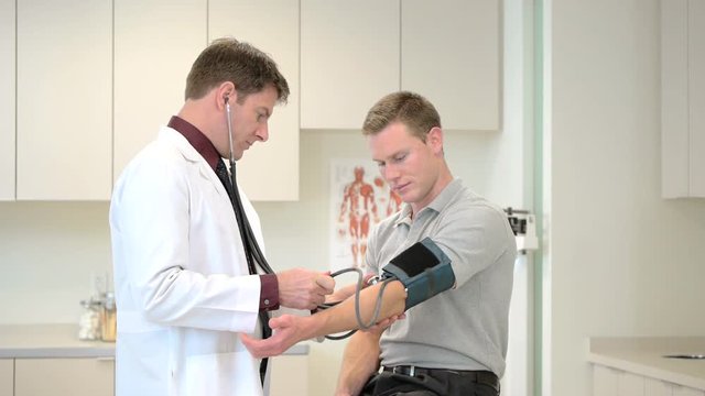 Doctor consulting patient in clinic