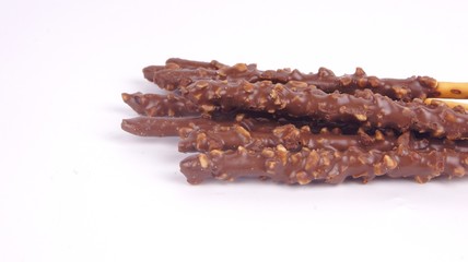 Biscuit stick dipped with chocolate almond nuts