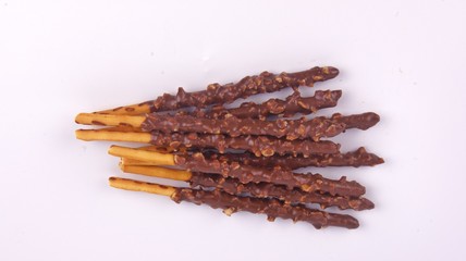 Biscuit stick dipped with chocolate almond nuts