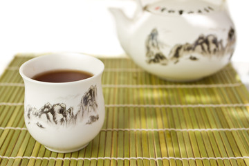 Chinese tea set on bamboo mat