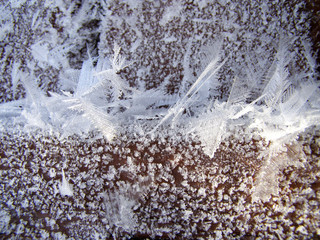 Frozen condensate. Snow crystals. Snowflakes are on the ceiling. White snowflakes.