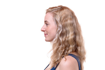 Side view of a young woman with blond curly hair