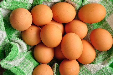 Eggs in a green cloth inside a wire basket
