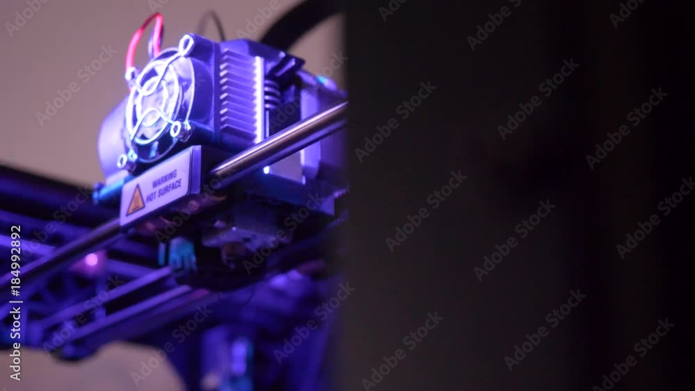 Poster close-up of 3d printer working. head of 3d printer in action. 3d printer is a new generation of tech
