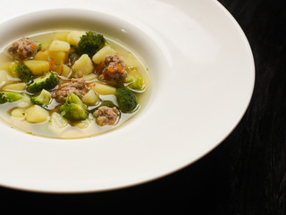 soup with meatballs, broccoli and vegetables