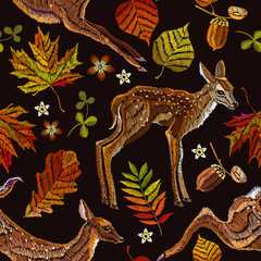 Obraz premium Embroidery deer, autumn seamless pattern. Fashionable template for design of clothes, t-shirt design. Classical september embroidery autumn leaves, fawn deer, oak and maple leaves