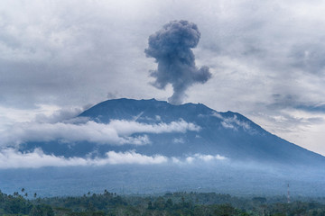 Agung volcano eruption view near rice fields, Bali, Indonesia