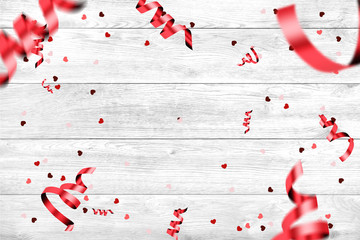 Festive web banner for Valentine's Day. Top view of a composition with a realistic gift in the shape of a heart, inscription love, confetti in the shape of a heart on a white background.