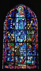 Stained glass window in the church of Sainte-Mere-Eglise, Normandy, France, depicting the landing...