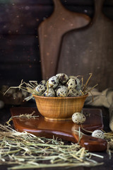 quail eggs in a wooden bowl