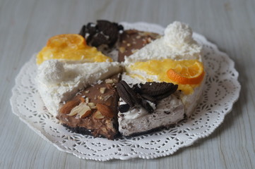 Four different cakes in one! Raffaello, almond cheesecake, Oreo, classic with tangerine curd. All together and one by one. Delicious on any background.