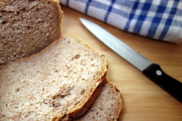Sliced homemade rye bread on a table in the kitchen