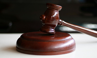 Wooden judge hammer is used in courts of law.