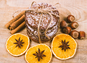 Gingerbread cookies, cinnamon and orange slices. Christmas decoration.