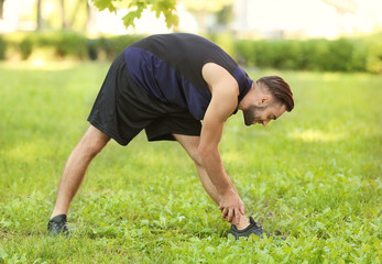 Sporty young man training outdoors