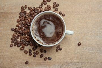 Ceramic cup with delicious black coffee on light background
